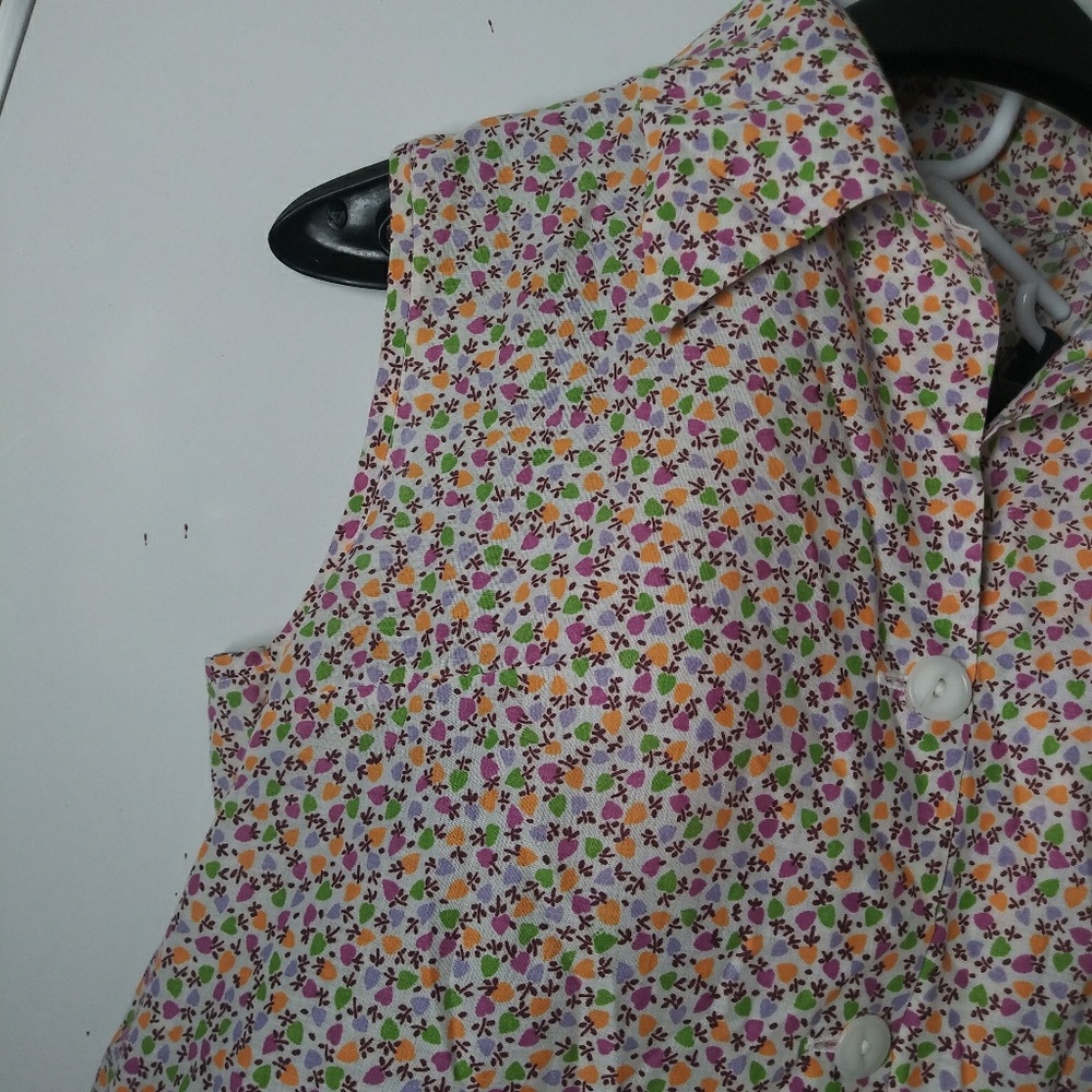 Sleeveless button front with pockets